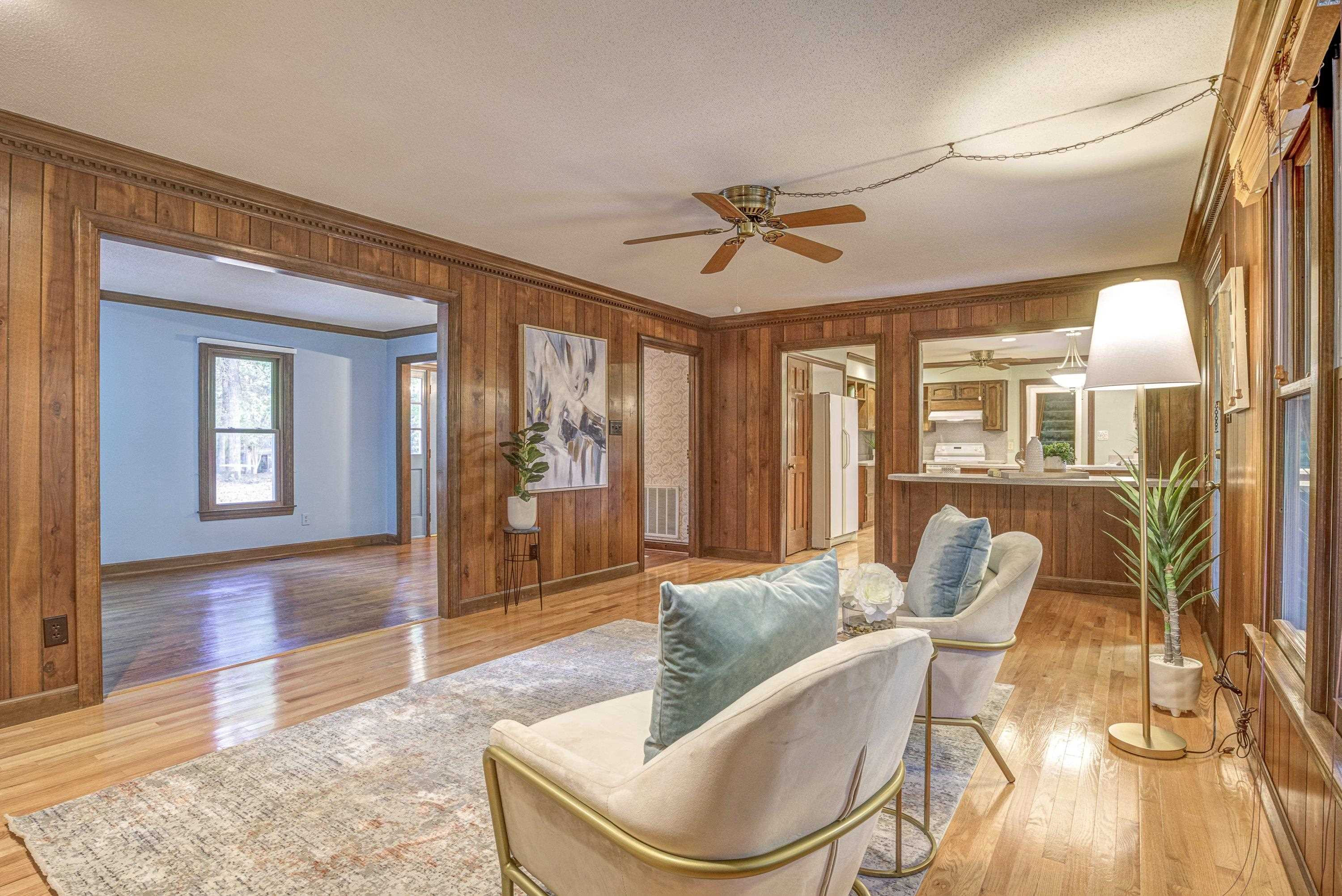 10213 Bushveld Lane Raleigh, NC 27613 - Photo 12 of 62 a living room with furniture and wooden floor