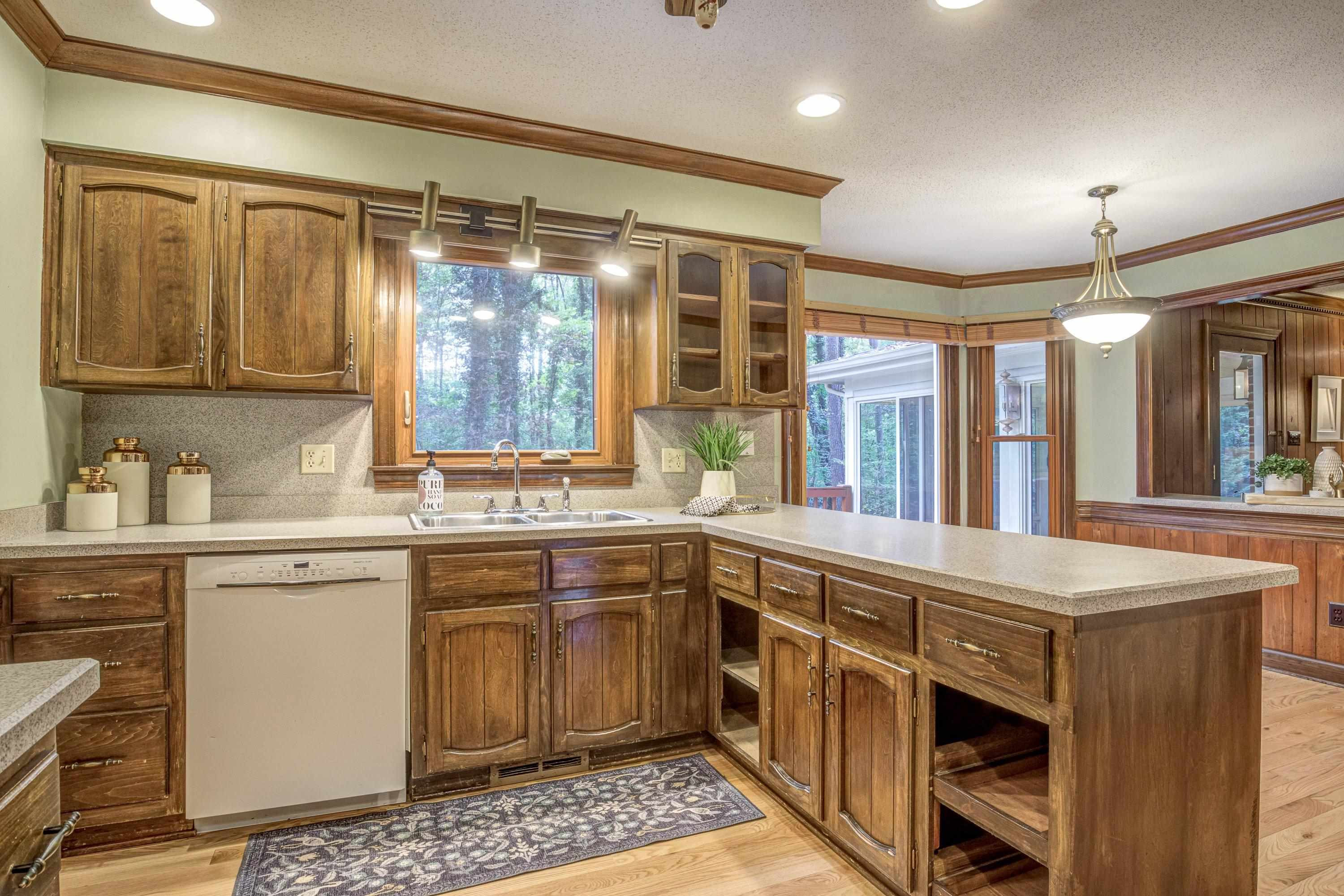 10213 Bushveld Lane Raleigh, NC 27613 - Photo 23 of 62 a kitchen with a sink and a window
