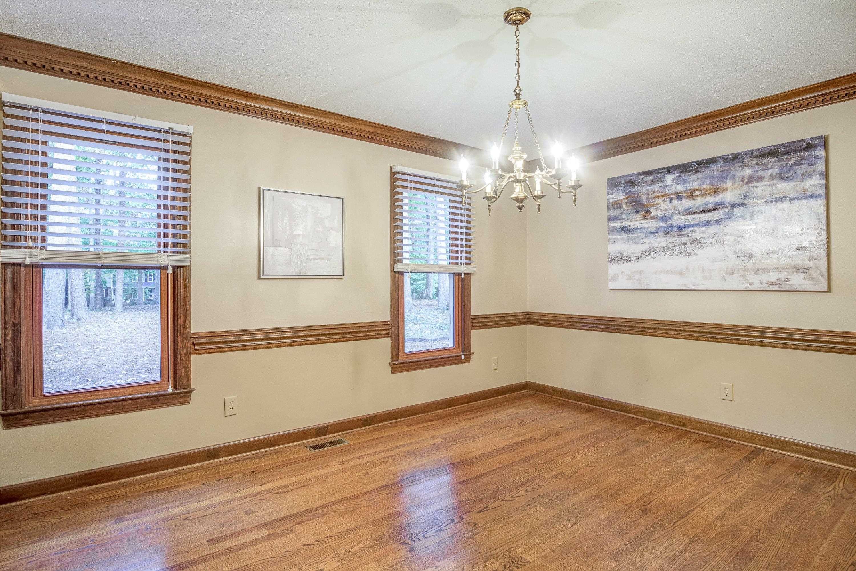10213 Bushveld Lane Raleigh, NC 27613 - Photo 25 of 62 a view of a room with window and chandelier