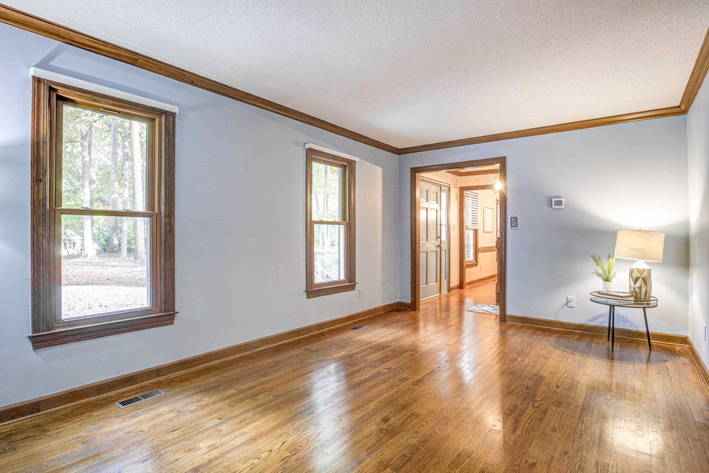 10213 Bushveld Lane Raleigh, NC 27613 - Photo 28 of 62 a view of an empty room with window and wooden floor