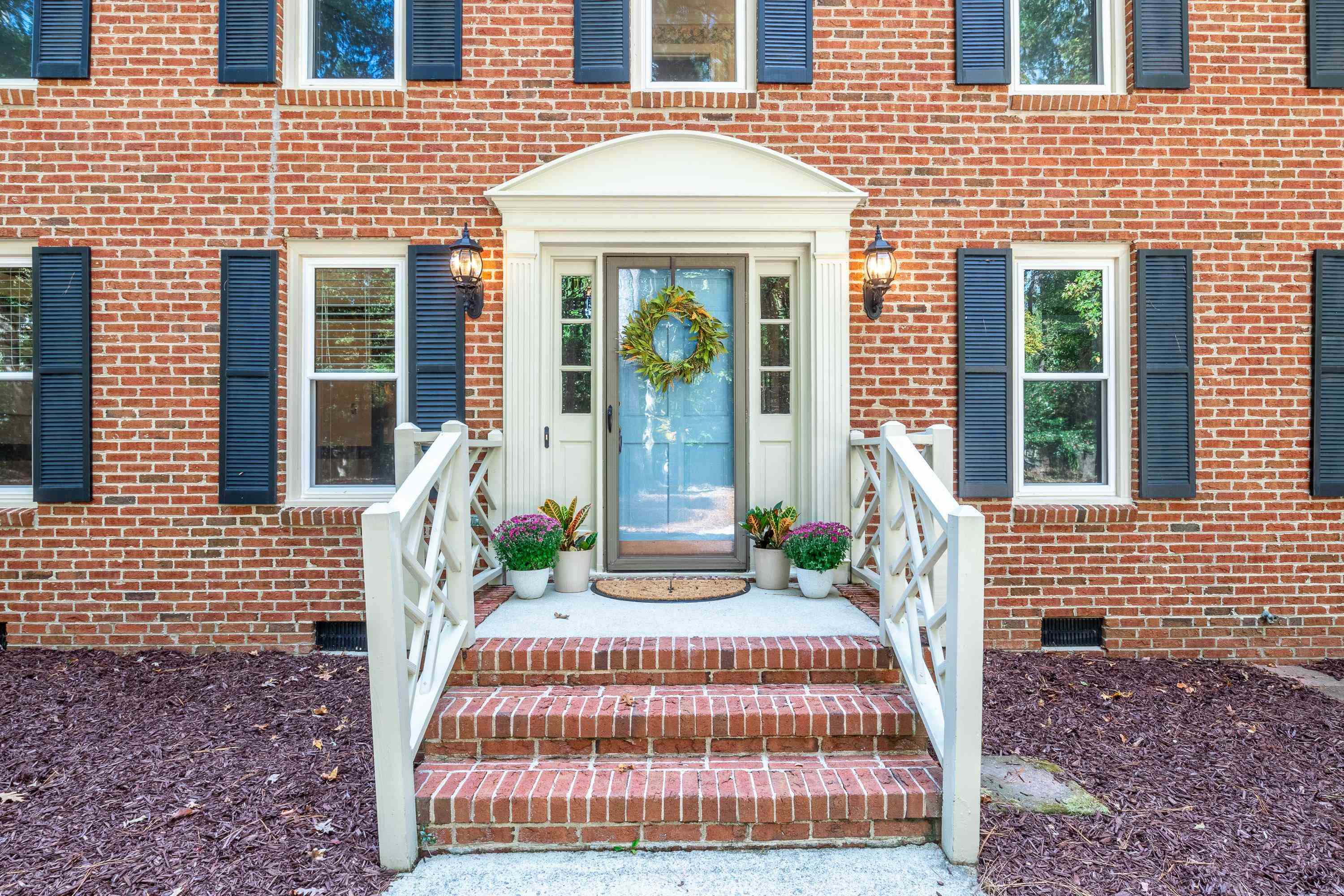 10213 Bushveld Lane Raleigh, NC 27613 - Photo 3 of 62 a front view of a house with a garden