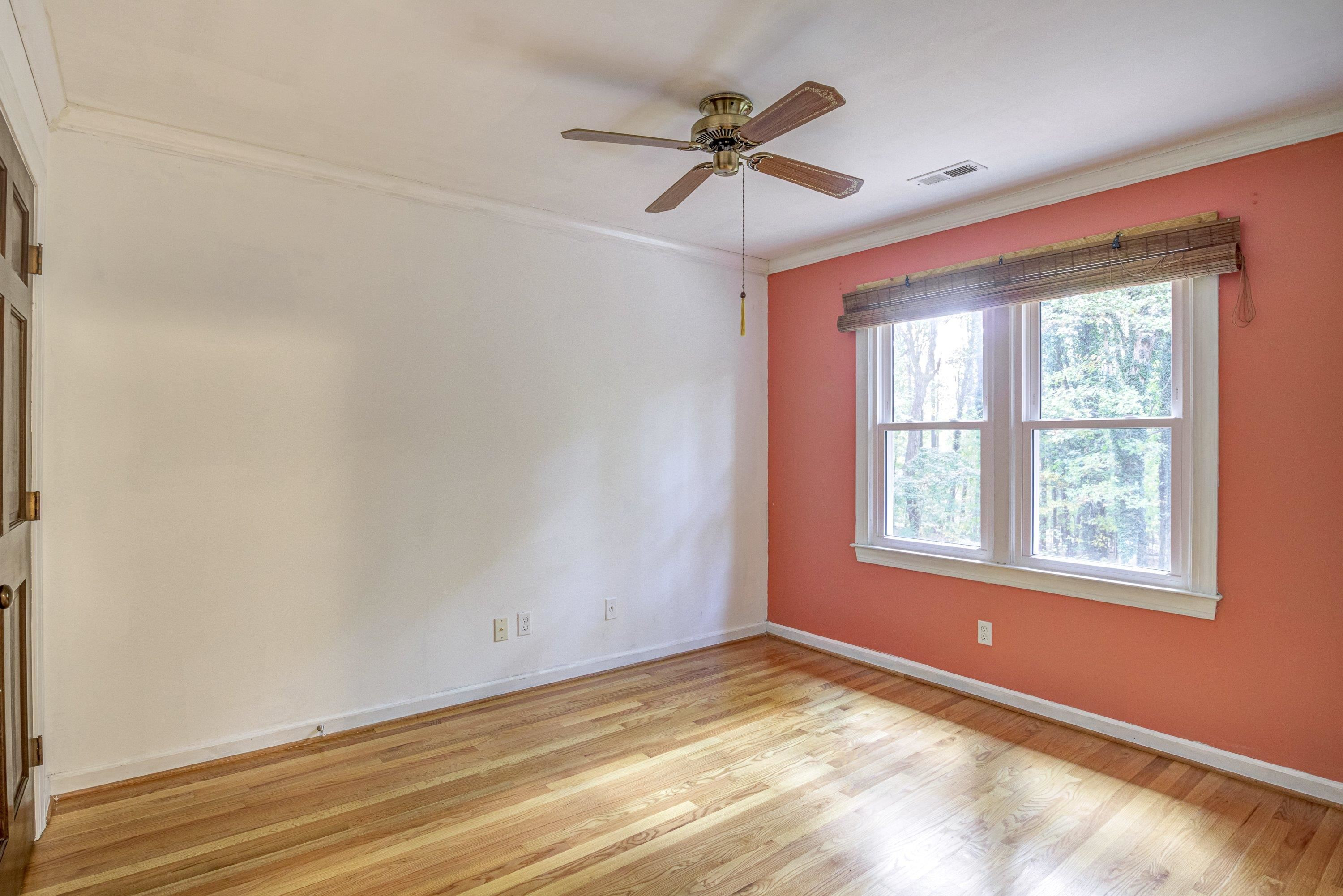 10213 Bushveld Lane Raleigh, NC 27613 - Photo 37 of 62 a view of empty room with wooden floor and fan