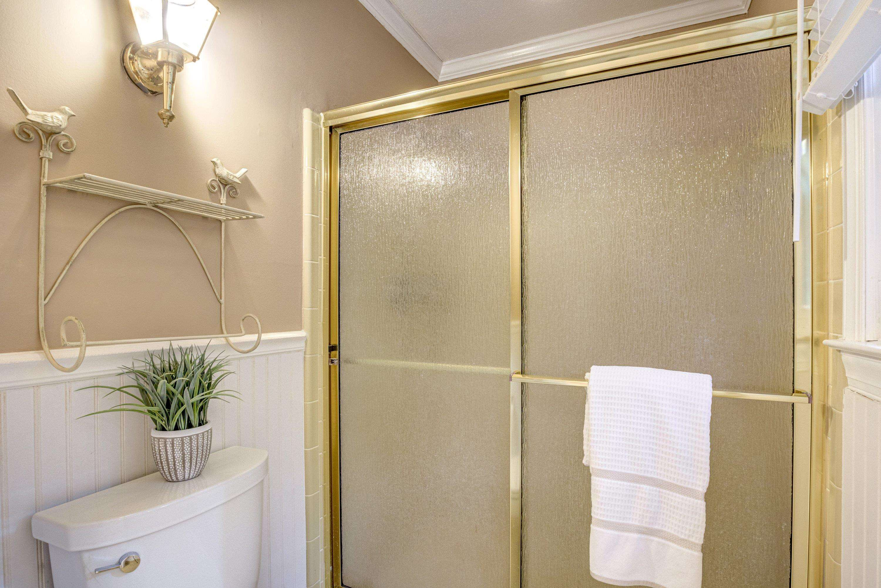 10213 Bushveld Lane Raleigh, NC 27613 - Photo 41 of 62 a bathroom with a shower curtain and a shower