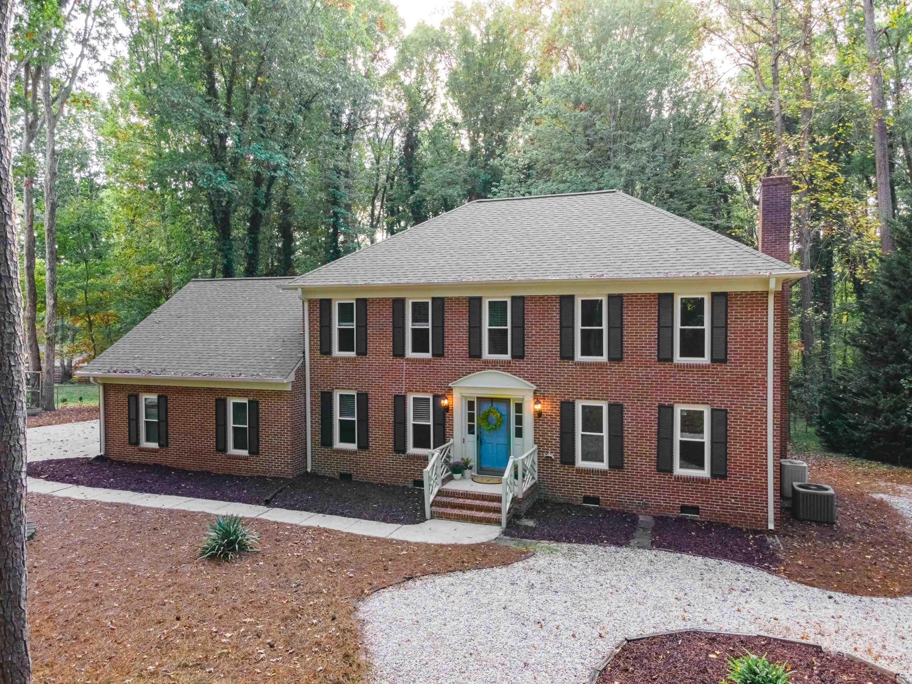 10213 Bushveld Lane Raleigh, NC 27613 - Photo 54 of 62 a front view of a house with a garden