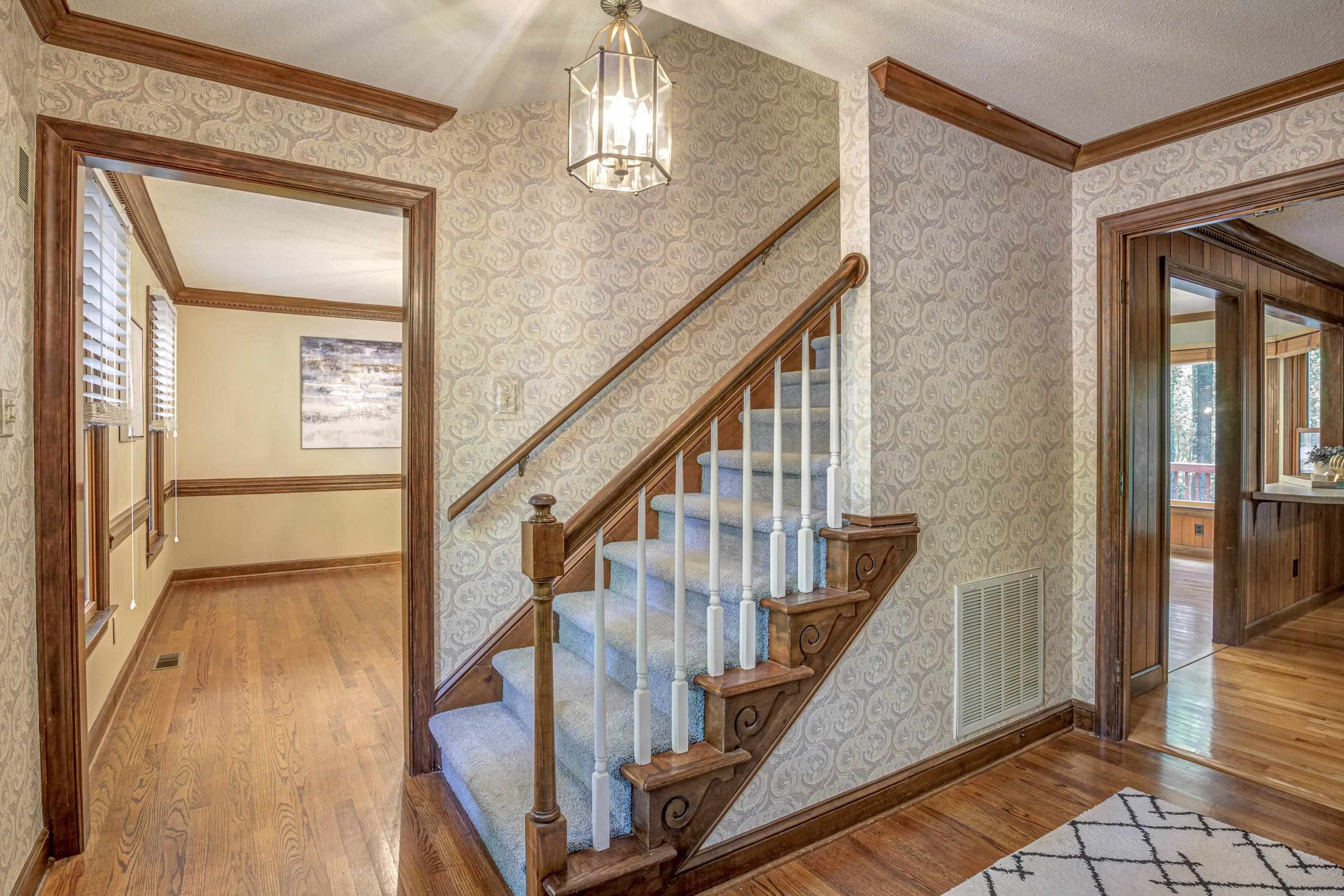 10213 Bushveld Lane Raleigh, NC 27613 - Photo 6 of 62 a view of an entryway with wooden floor and door