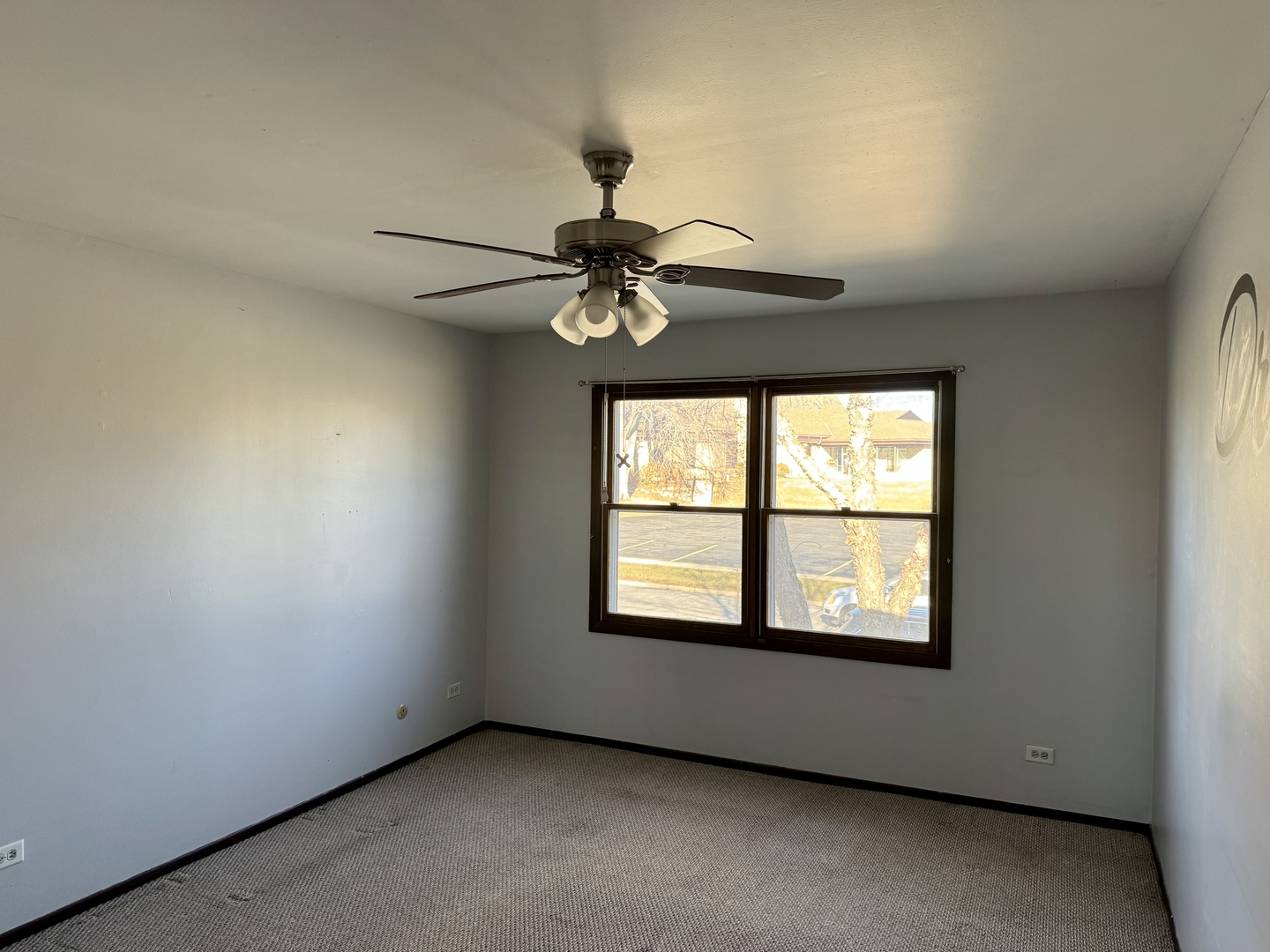 412 St Johns Road, Unit D Woodstock, IL 60098 - Photo 11 of 19 a view of an empty room with a window