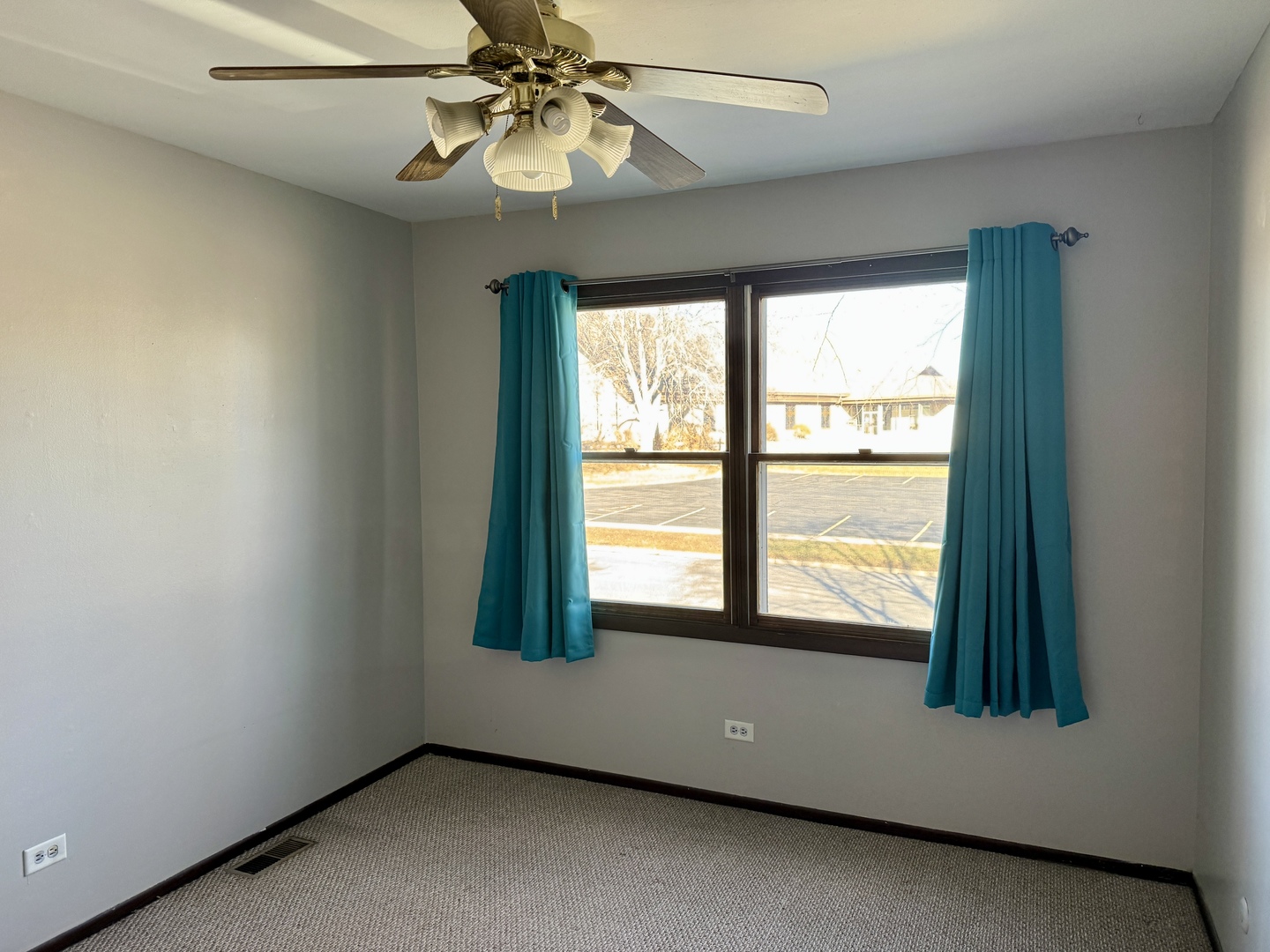 412 St Johns Road, Unit D Woodstock, IL 60098 - Photo 18 of 19 a view of an empty room with a window