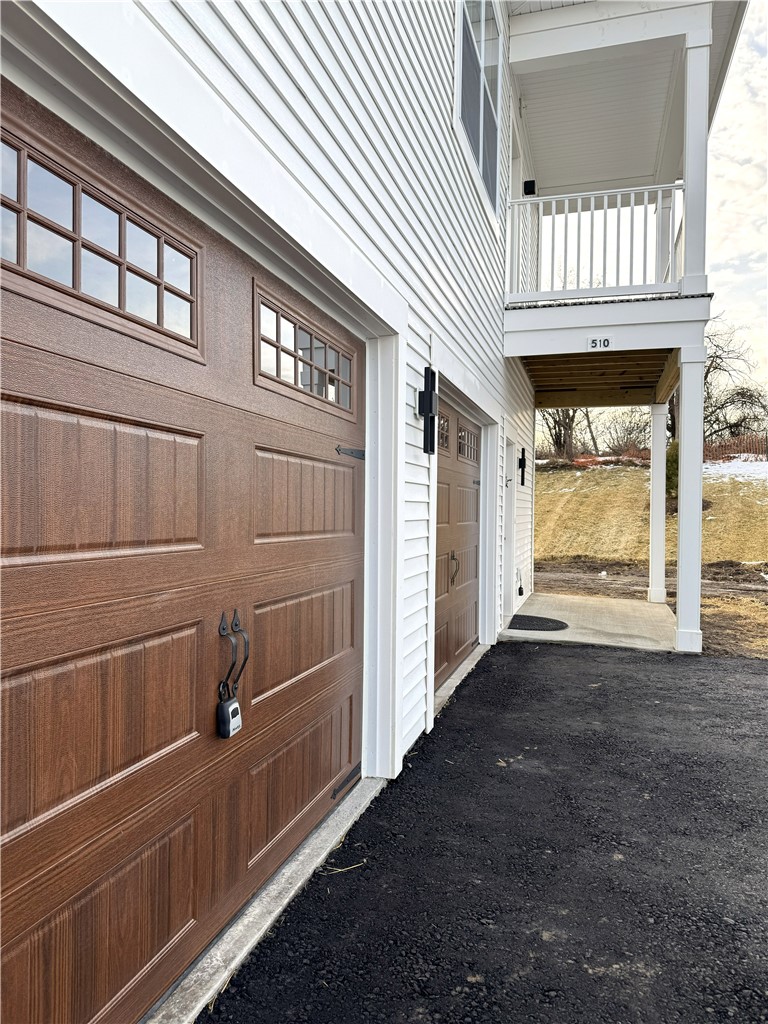 410 Erie Rdg Drive Henrietta, NY 14467 - Photo 12 of 13 Typical end unit covered balcony above covered pri