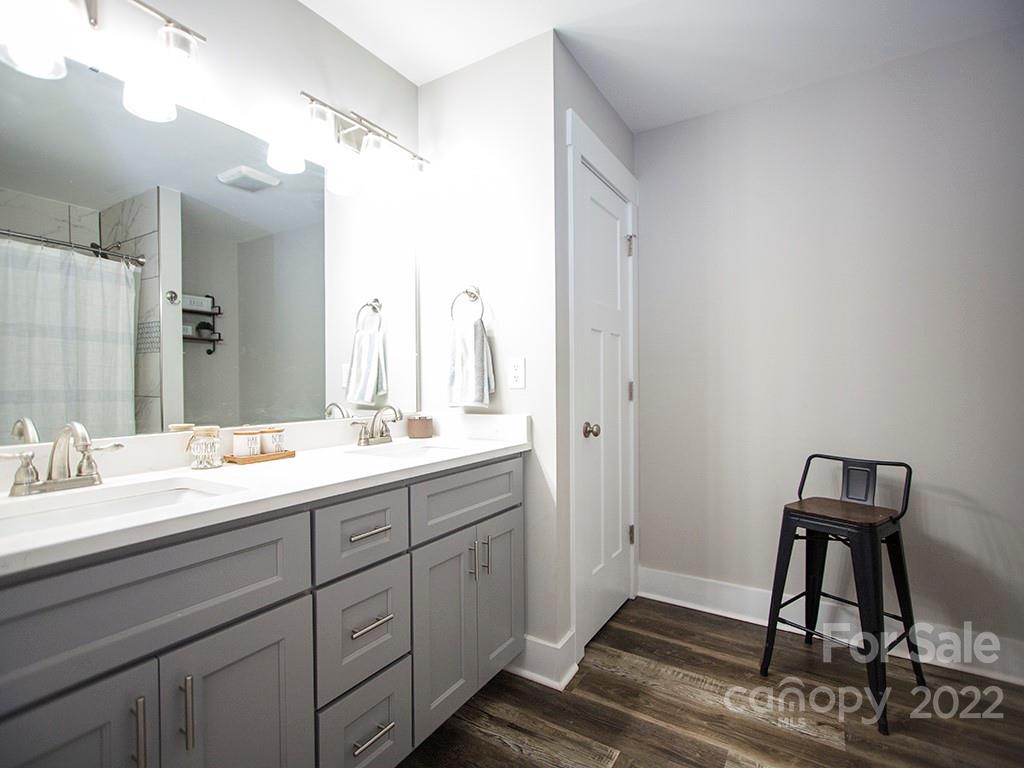 1350 Miles Road Dallas, NC 28034 - Photo 14 of 17 a en suite bathroom with a double vanity sink and a mirror