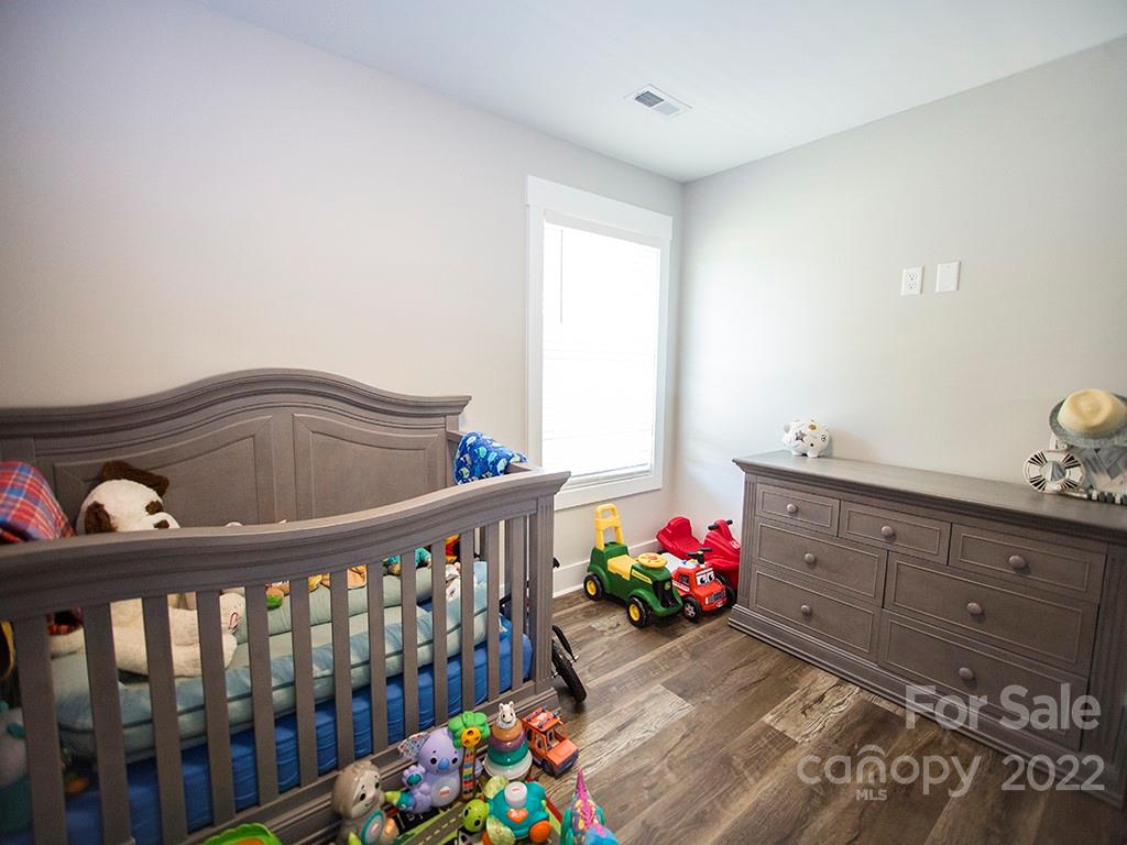 1350 Miles Road Dallas, NC 28034 - Photo 17 of 17 a bedroom with furniture and a baby crib