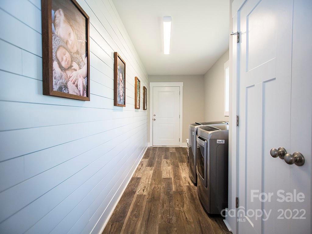1350 Miles Road Dallas, NC 28034 - Photo 6 of 17 a view of a hallway with wooden floor and staircase