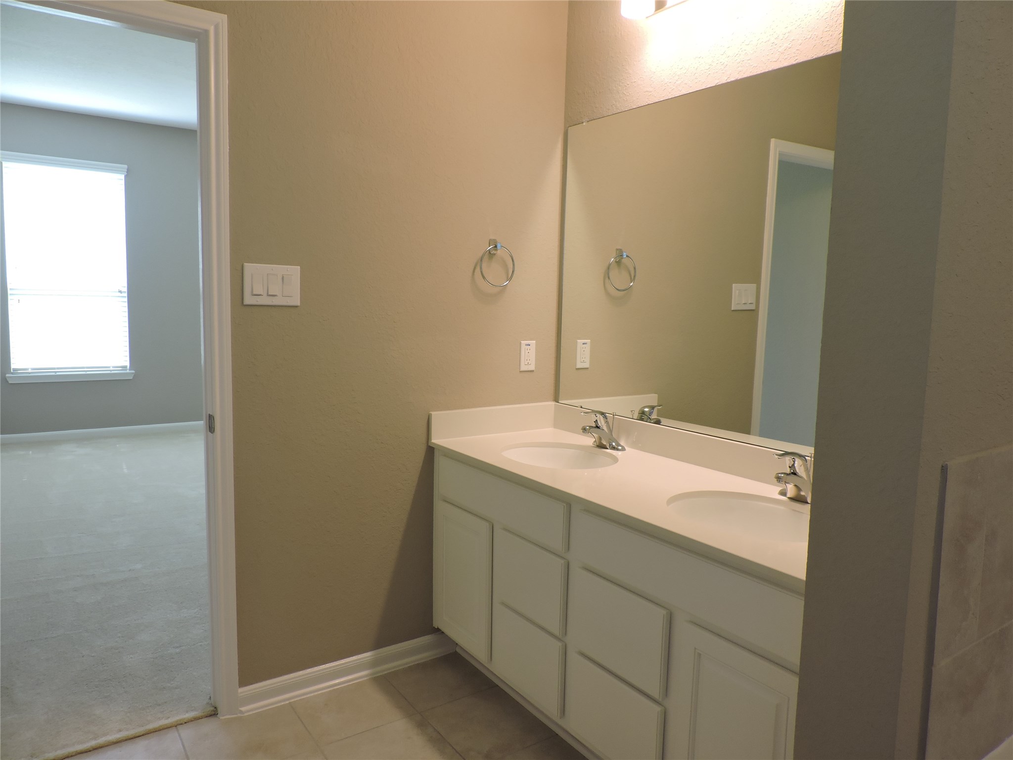 1102 Upton Court Conroe, TX 77304 - Photo 13 of 30 a bathroom with a sink and a mirror
