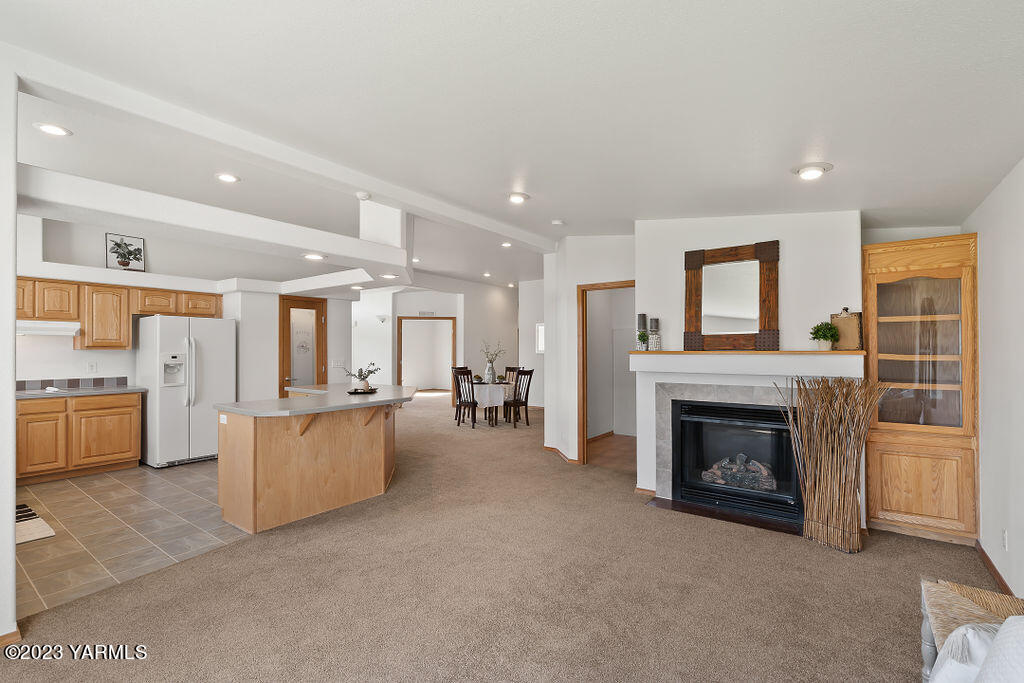1305 Faucher Road Moxee, WA 98936 - Photo 14 of 40 a living room with furniture and a fireplace
