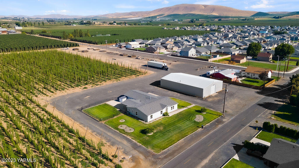 1305 Faucher Road Moxee, WA 98936 - Photo 36 of 40 an aerial view of a house with a garden and lake view