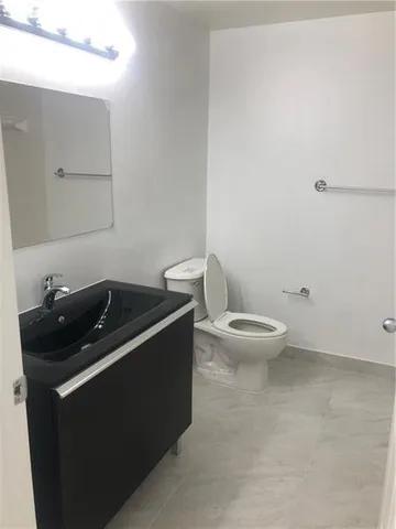 a close up of a sink and a toilet