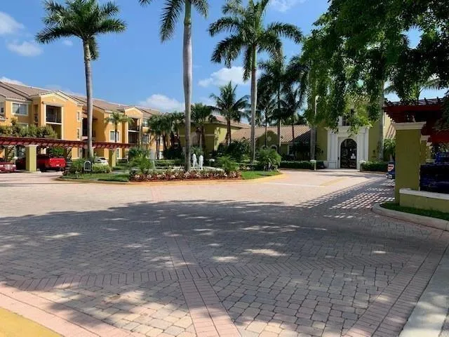 a view of a backyard with wooden fence