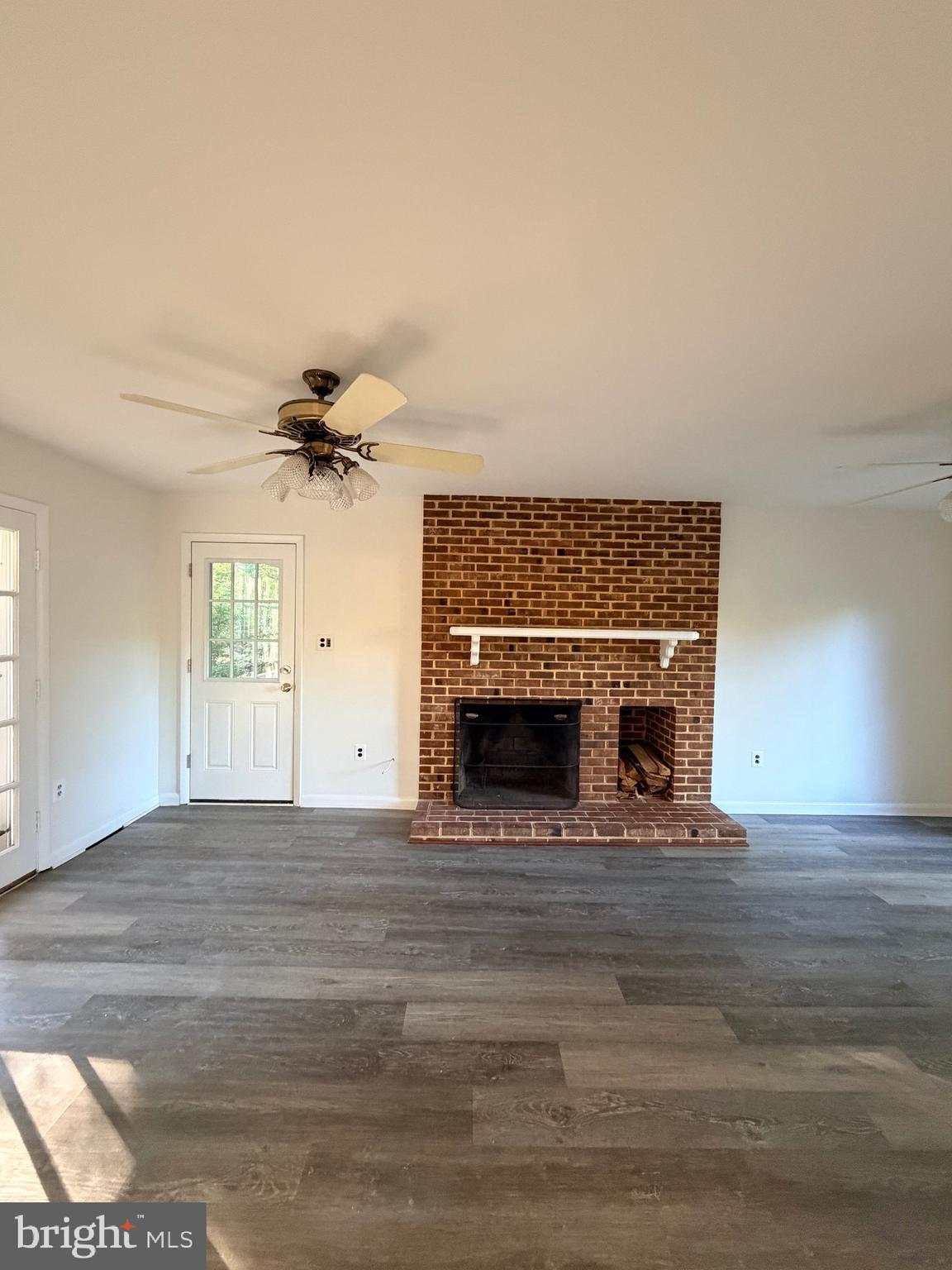 9513 Stevebrook Road Fairfax, VA 22032 - Photo 14 of 37 a view of an empty room with window and fireplace