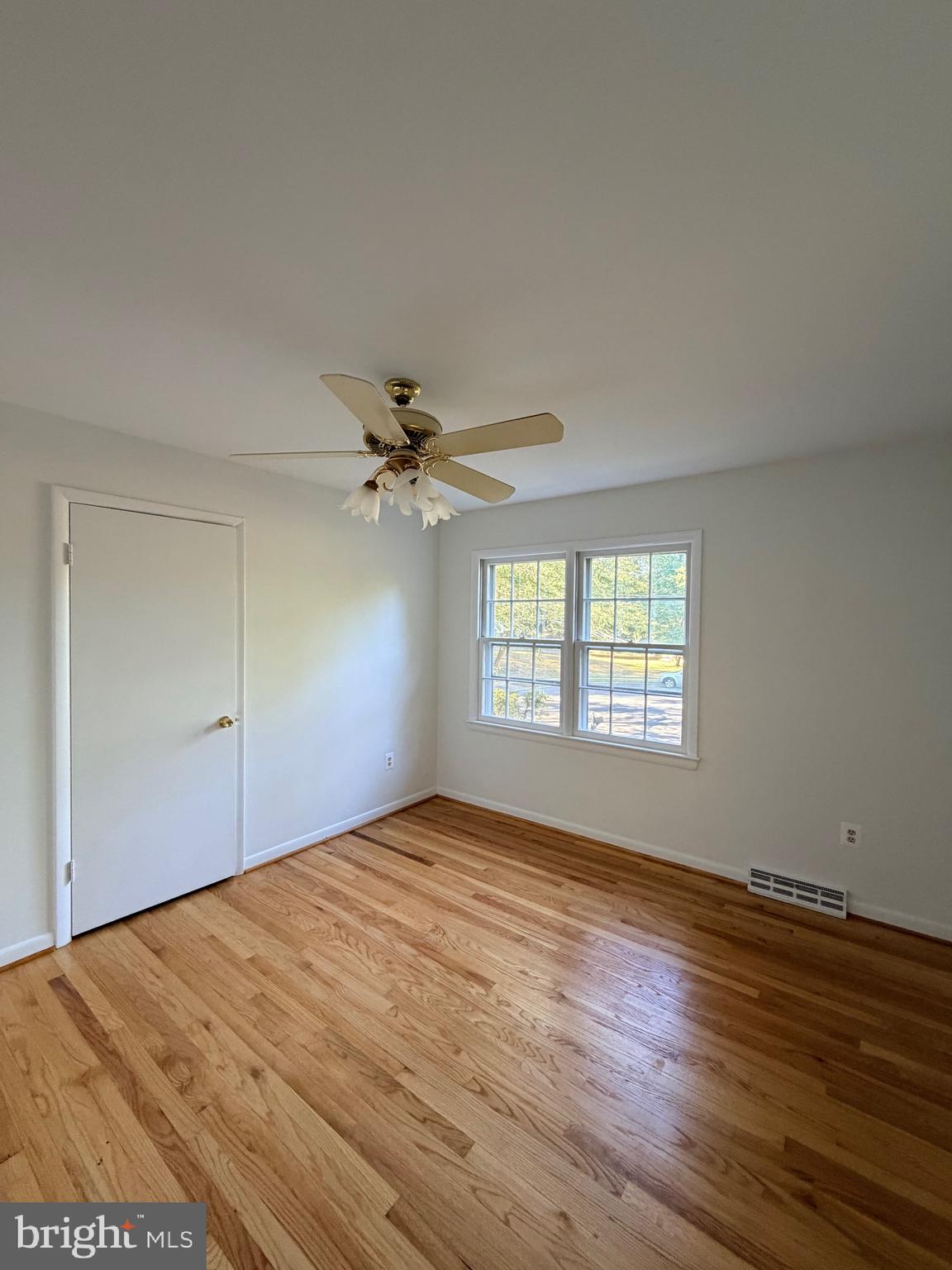 9513 Stevebrook Road Fairfax, VA 22032 - Photo 25 of 37 a view of empty room with wooden floor and fan