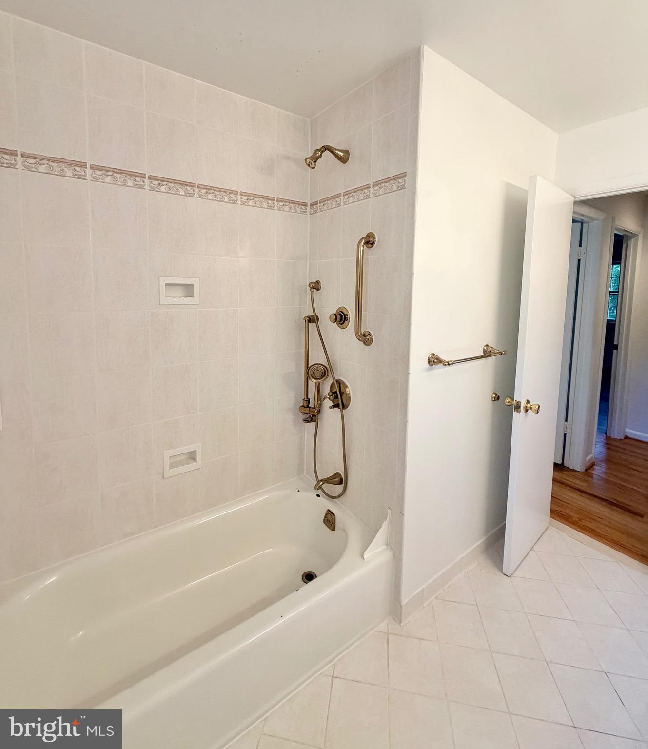 9513 Stevebrook Road Fairfax, VA 22032 - Photo 28 of 37 a bathroom with a bathtub and a shower