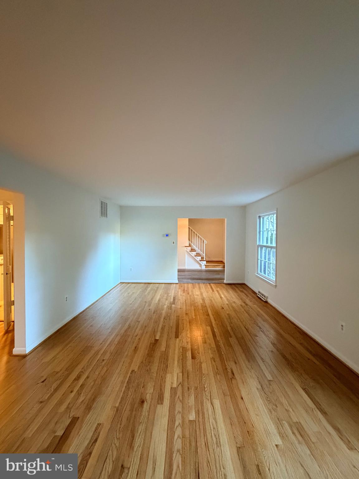 9513 Stevebrook Road Fairfax, VA 22032 - Photo 31 of 37 a view of empty room with wooden floor