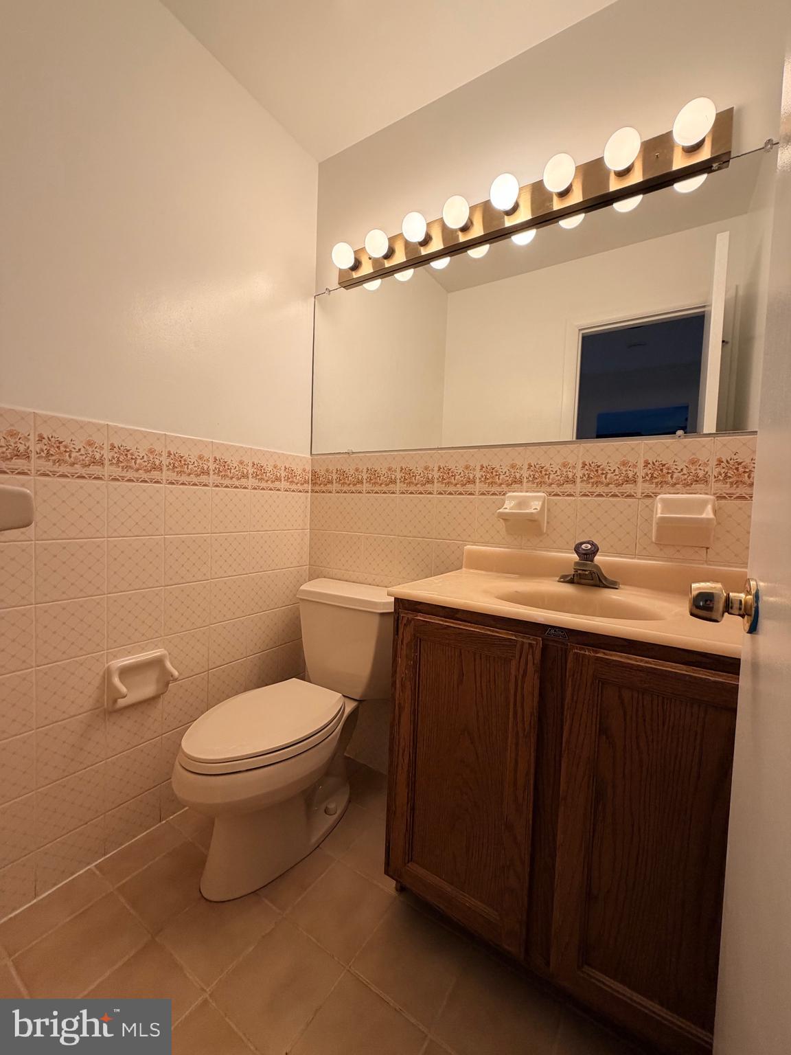 9513 Stevebrook Road Fairfax, VA 22032 - Photo 34 of 37 a bathroom with a sink vanity mirror and toilet