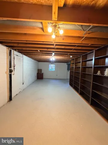 a view of an empty room with stairs