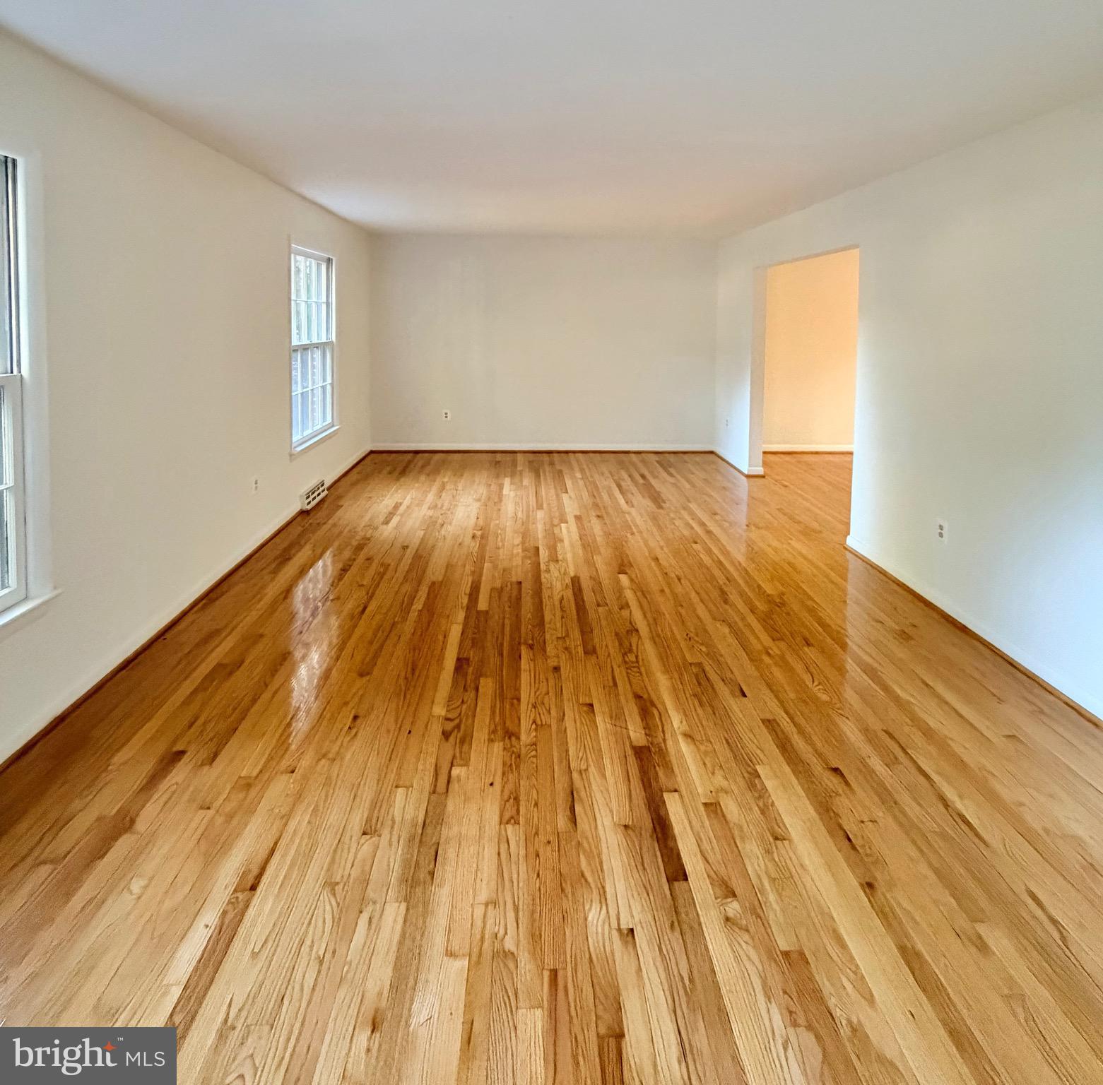 9513 Stevebrook Road Fairfax, VA 22032 - Photo 4 of 37 a view of empty room with wooden floor and fan