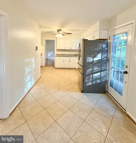 a view of a bathroom with a tub and shower