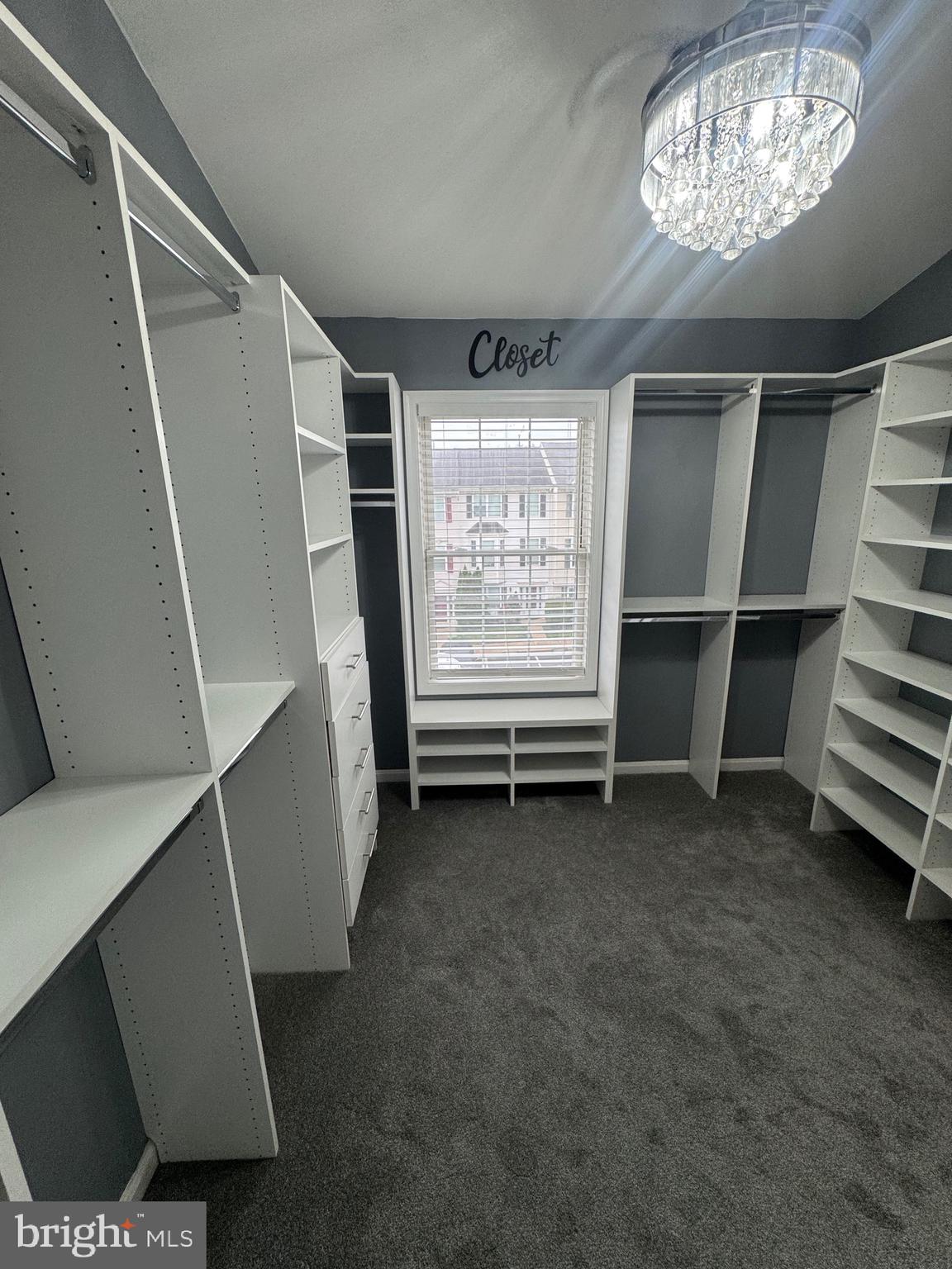 7705 Periwinkle Way, Unit 71 Severn, MD 21144 - Photo 26 of 28 a view of an empty room with a window