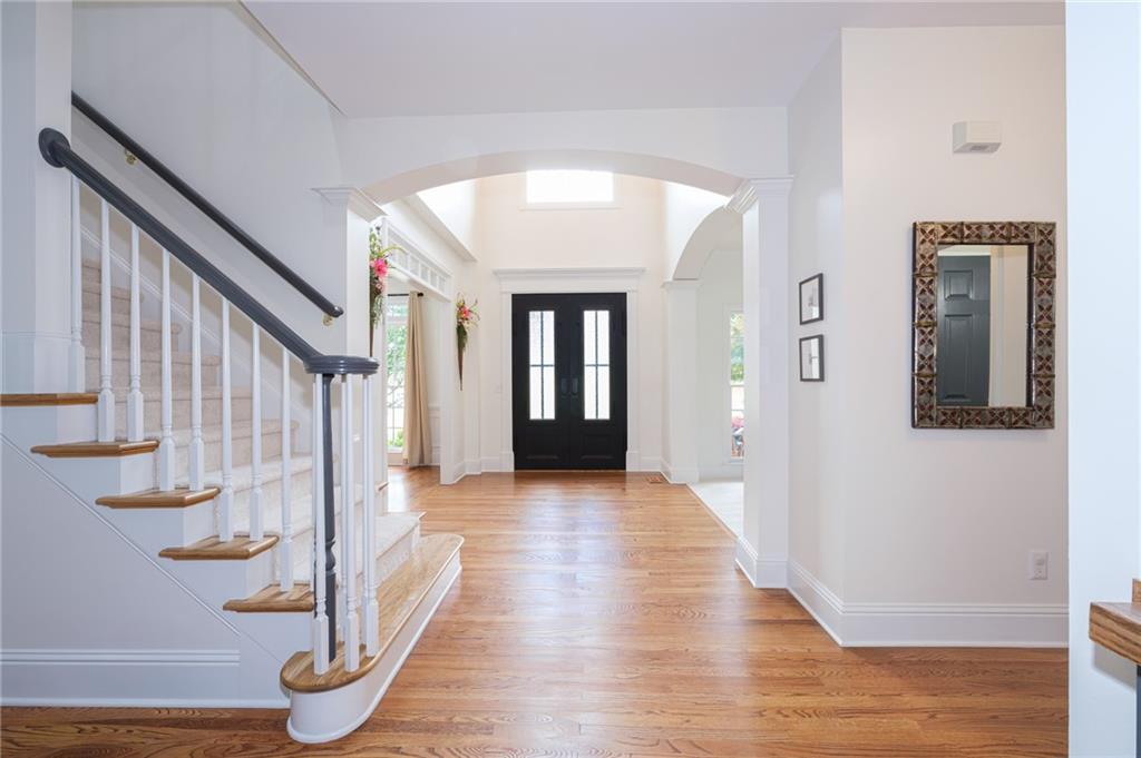 4330 Farmbrook Lane Cumming, GA 30041 - Photo 5 of 46 a view of entryway with wooden floor and stairs