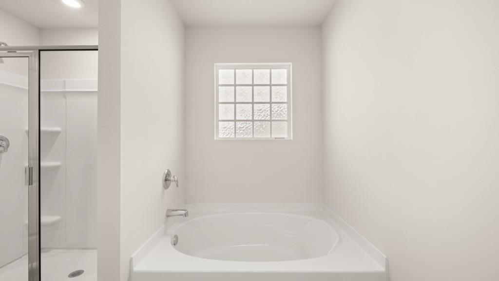 43 Rolling Mdw Trace Jasper, GA 30143 - Photo 19 of 38 a white bath tub sitting next to a window