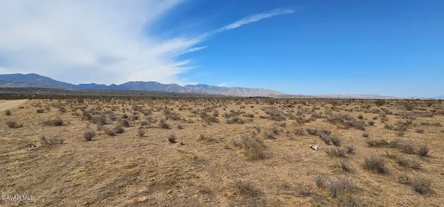 a view of an outdoor space and a mountain view