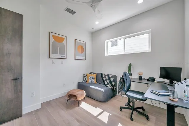 a workspace with furniture and window