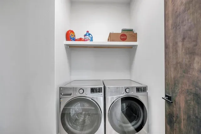 a utility room with dryer and washer