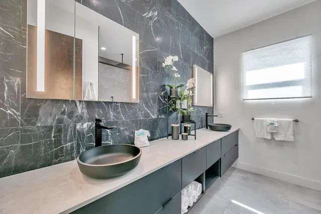 a bathroom with a sink and a mirror