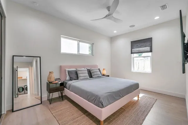 a bedroom with a bed and window