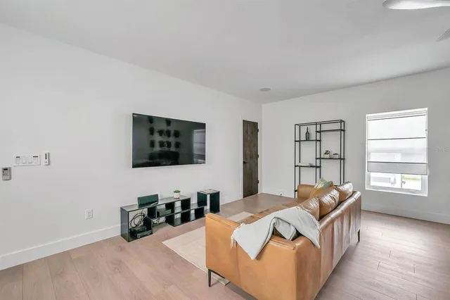 a bedroom with furniture and a window