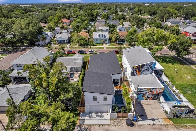 an aerial view of residential houses with outdoor space