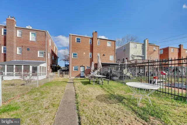a view of residential houses with swimming pool