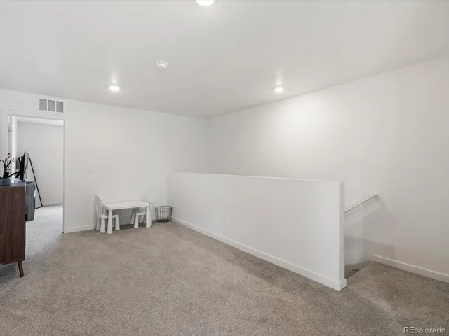 a workspace with furniture and window