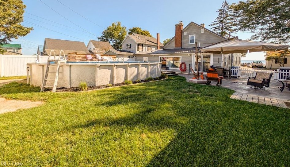 41 Poplar Street Huron, OH 44839 - Photo 28 of 37 Back of house with a patio and a chimney