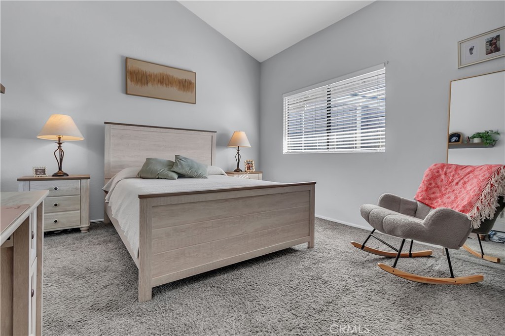 15251 Leffingwell Road, Unit 8 Whittier, CA 90604 - Photo 11 of 26 a bedroom with a bed and a lamp