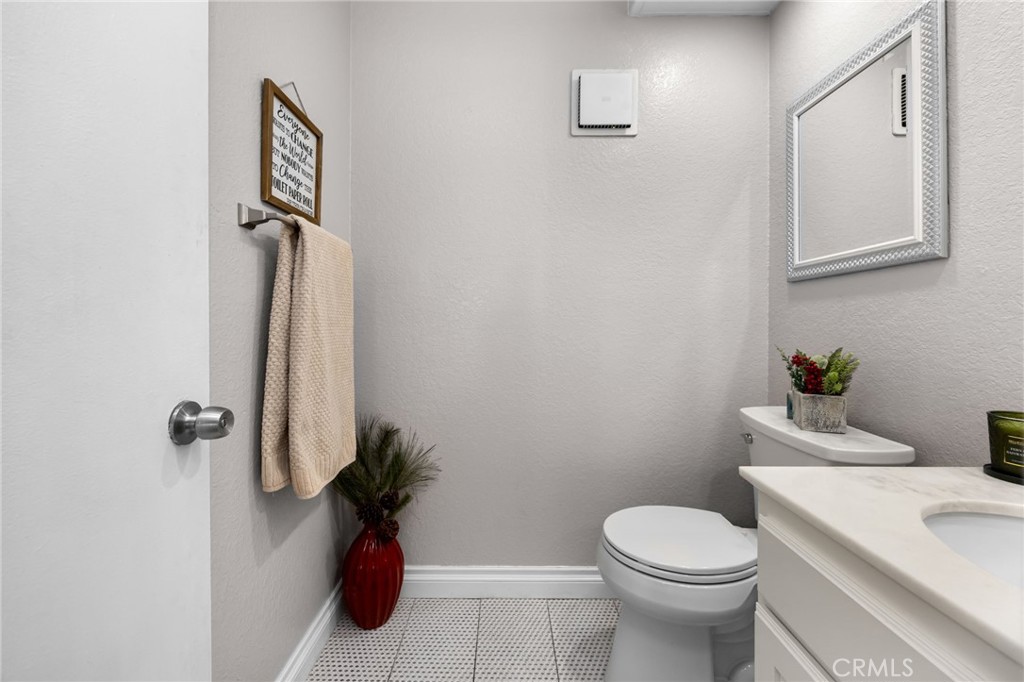 15251 Leffingwell Road, Unit 8 Whittier, CA 90604 - Photo 12 of 30 a bathroom with a toilet and a shower curtain