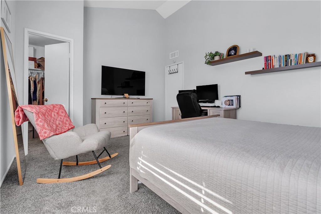 15251 Leffingwell Road, Unit 8 Whittier, CA 90604 - Photo 12 of 26 a bedroom with a bed and a flat screen tv