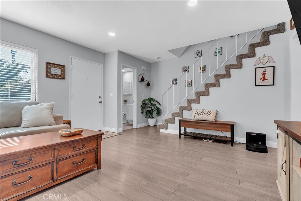 15251 Leffingwell Road, Unit 8 Whittier, CA 90604 - Photo 13 of 26 a living room with furniture and wooden floor