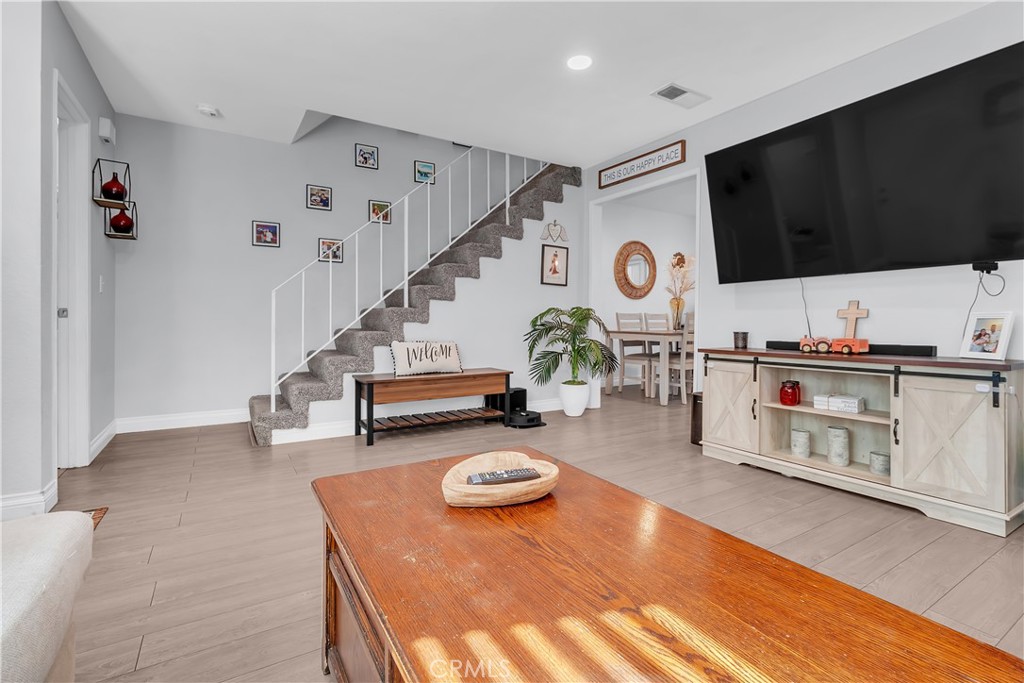 15251 Leffingwell Road, Unit 8 Whittier, CA 90604 - Photo 14 of 26 a living room with furniture and a flat screen tv