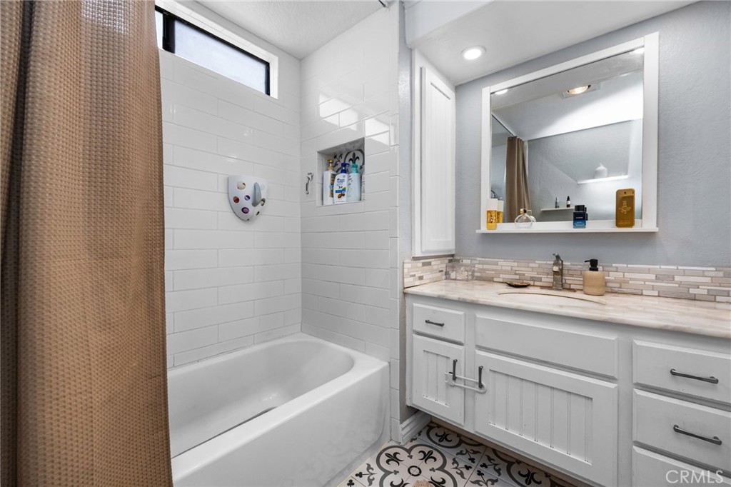 15251 Leffingwell Road, Unit 8 Whittier, CA 90604 - Photo 17 of 30 a bathroom with a tub sink double vanity and mirror