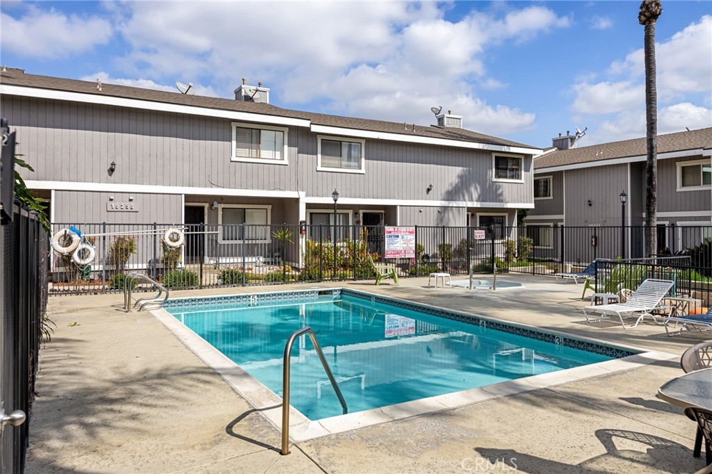 15251 Leffingwell Road, Unit 8 Whittier, CA 90604 - Photo 24 of 30 a view of a house with swimming pool and sitting area