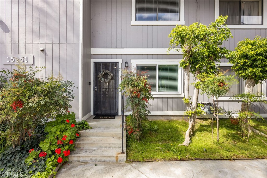 15251 Leffingwell Road, Unit 8 Whittier, CA 90604 - Photo 3 of 30 a front view of a house with garden