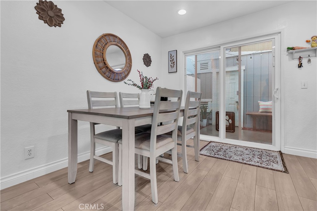 15251 Leffingwell Road, Unit 8 Whittier, CA 90604 - Photo 5 of 26 a view of a dining room with furniture and wooden floor